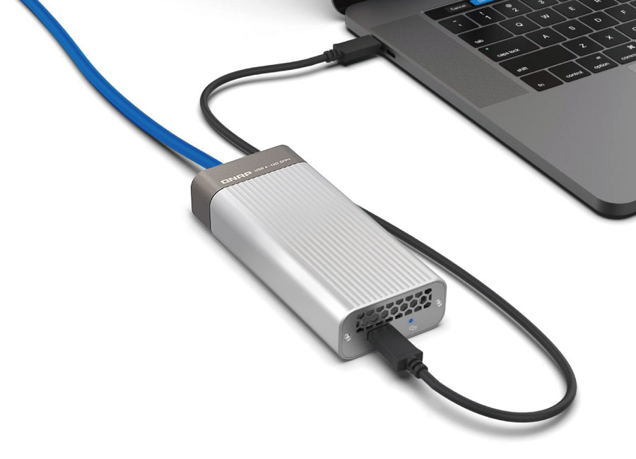 QNAP QNA-UC10G1SF connected to a laptop via USB Type-C and SFP+ cable