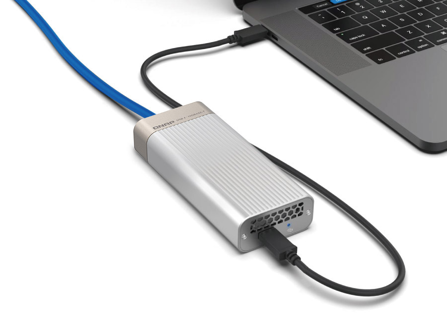 QNAP QNA-UC10G1T connected to a laptop via USB Type-C and RJ45 cable